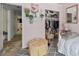Cozy bedroom featuring organized closet space, neutral decor, and a comfortable bed at 2030 Buford Dam Rd, Buford, GA 30518