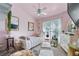 Charming bedroom with pink walls, soft natural light, and ornate furniture, perfect for relaxation and comfort at 2030 Buford Dam Rd, Buford, GA 30518