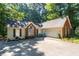 Well-maintained home with an attached two-car garage and a spacious driveway at 2030 Buford Dam Rd, Buford, GA 30518