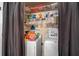 Functional laundry room features a washer, dryer, and ample storage, making laundry tasks convenient and organized at 2030 Buford Dam Rd, Buford, GA 30518