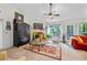 Bright living room with fireplace, large windows, and ample seating at 2030 Buford Dam Rd, Buford, GA 30518