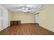 Expansive living room featuring wood floors and natural light with ceiling fan at 2030 Buford Dam Rd, Buford, GA 30518