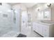 Bright bathroom boasting marble tile flooring, glass enclosed shower, and white vanity for a clean aesthetic at 5300 Peachtree Rd # 3207, Chamblee, GA 30341