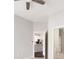 Hallway with carpet floors, neutral color palette, and view to the kitchen and bathroom with modern design at 5300 Peachtree Rd # 3207, Chamblee, GA 30341