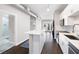 Stylish kitchen with white cabinets, island, stainless steel appliances, and an adjacent bathroom at 5300 Peachtree Rd # 3207, Chamblee, GA 30341