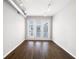Bright, airy living room with hardwood floors and balcony access at 5300 Peachtree Rd # 3207, Chamblee, GA 30341