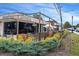 Charming restaurant with outdoor dining area, flowerbeds, and rustic brick architecture at 5300 Peachtree Rd # 3207, Chamblee, GA 30341