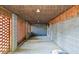 Spacious garage with cinderblock walls featuring lighting and a concrete floor at 5500 Mccoy Nw Rd, Acworth, GA 30101