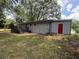 Image of the backyard featuring a wooden deck and a freshly painted exterior at 8236 Tudor Dr, Jonesboro, GA 30238