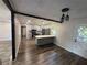 Open kitchen with white cabinets, stainless steel appliances, and a kitchen island at 8236 Tudor Dr, Jonesboro, GA 30238