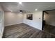 Bright living room featuring recessed lighting, modern ceiling fan, fresh paint, and beautiful laminate flooring at 8236 Tudor Dr, Jonesboro, GA 30238