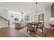 Bright dining area with stylish decor, hardwood floors, staircase, and ample space for entertaining at 933 Willingham Dr # 9, Hapeville, GA 30354