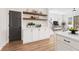 Bright kitchen with a dining area, open shelving, and a view into the living space at 933 Willingham Dr # 9, Hapeville, GA 30354