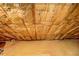 An attic interior with insulation, wood floors, and other visible structural components at 1216 Valley Dr, Conyers, GA 30012