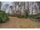 Large backyard with mature trees offers a private and serene setting at 1216 Valley Dr, Conyers, GA 30012