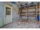 Unfinished basement with ample storage space and access door at 1216 Valley Dr, Conyers, GA 30012