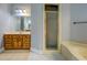Bathroom with vanity, shower, and tub at 1216 Valley Dr, Conyers, GA 30012