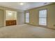 Spacious bedroom with carpet, two windows, and a vanity area between two double closets at 1216 Valley Dr, Conyers, GA 30012