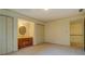 Carpeted bedroom with bathroom vanity in a nook between two double closets at 1216 Valley Dr, Conyers, GA 30012