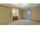 Bright bedroom with carpet, window, and vanity nook between two double closets at 1216 Valley Dr, Conyers, GA 30012