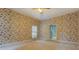 Bedroom with floral wallpaper and access to a patio or balcony at 1216 Valley Dr, Conyers, GA 30012
