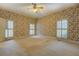 Bedroom with floral wallpaper and multiple windows for lots of natural light at 1216 Valley Dr, Conyers, GA 30012
