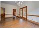 Dining room with hardwood floors and multiple entryways to other rooms at 1216 Valley Dr, Conyers, GA 30012