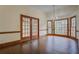 Dining room with hardwood floors, natural light, a chandelier, and a view outdoors at 1216 Valley Dr, Conyers, GA 30012