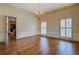 Elegant dining room featuring hardwood floors, decorative wallpaper, a chandelier, and large windows at 1216 Valley Dr, Conyers, GA 30012