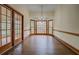 Dining room with hardwood floors, a chandelier, natural light and french doors at 1216 Valley Dr, Conyers, GA 30012