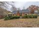 Charming brick home featuring a screened porch and manicured landscaping in the backyard at 1216 Valley Dr, Conyers, GA 30012