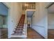 Inviting foyer featuring beautiful hardwood floors, an elegant staircase, and traditional design elements at 1216 Valley Dr, Conyers, GA 30012