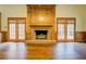A spacious living room features a fireplace, hardwood floors, and backyard access at 1216 Valley Dr, Conyers, GA 30012