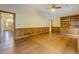 Open living room with wood paneling and built-in shelves at 1216 Valley Dr, Conyers, GA 30012