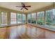 Bright sunroom with hardwood floors and large windows offering views of the backyard at 1216 Valley Dr, Conyers, GA 30012