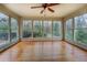 Spacious sunroom featuring hardwood floors, large windows, and tranquil views of nature at 1216 Valley Dr, Conyers, GA 30012