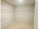 Walk-in closet featuring extensive shelving for optimal organization and storage solutions at 305 Melanie Ct, Bowdon, GA 30108