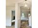 Open concept living space shows the layout of a new home with fireplace and neutral walls, ceilings, and trim at 305 Melanie Ct, Bowdon, GA 30108