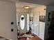 Welcoming entryway featuring a decorative front door, hardwood floors, and stylish accents at 521 Deadwood Trl, Locust Grove, GA 30248