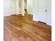 Basement living room with wood-look floors and white doors at 661 Kennesaw Se Dr, Smyrna, GA 30080