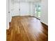 Basement living room with wood-look floors, french doors to the exterior at 661 Kennesaw Se Dr, Smyrna, GA 30080