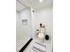 Beautifully updated bathroom with a stylish tile shower and modern fixtures at 661 Kennesaw Se Dr, Smyrna, GA 30080