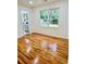 Bedroom with gleaming hardwood floors and window view at 661 Kennesaw Se Dr, Smyrna, GA 30080