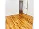 Bright bedroom featuring hardwood floors and a white door at 661 Kennesaw Se Dr, Smyrna, GA 30080
