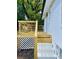 New wooden deck with white brick exterior walls and horizontal railings at 661 Kennesaw Se Dr, Smyrna, GA 30080