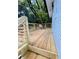 New wooden deck with horizontal railings and brick exterior walls at 661 Kennesaw Se Dr, Smyrna, GA 30080
