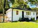Renovated home featuring a new deck, updated paint, and modern design at 661 Kennesaw Se Dr, Smyrna, GA 30080