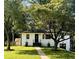 Charming white brick home with lush landscaping and inviting walkway at 661 Kennesaw Se Dr, Smyrna, GA 30080