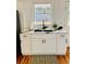 Kitchenette with white marble counters, storage, and matte black faucet at 661 Kennesaw Se Dr, Smyrna, GA 30080