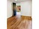 Bright living room features vinyl flooring, neutral paint colors, and natural light from the backyard at 661 Kennesaw Se Dr, Smyrna, GA 30080
